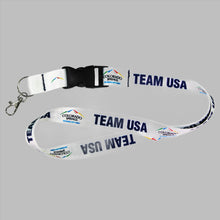 Load image into Gallery viewer, White lanyard with a black detachable buckle decorated with with official City of Colorado Springs: Olympic City USA and Team USA logos and wordmarks
