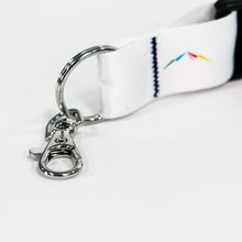 Load image into Gallery viewer, Up close view of the sliver-colored trigger hook on a white lanyard
