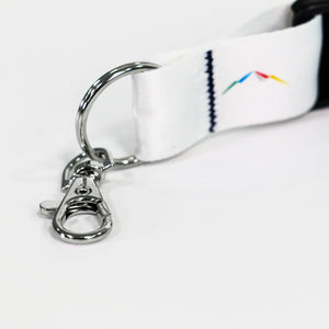 Up close view of the sliver-colored trigger hook on a white lanyard