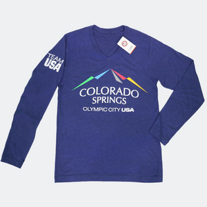 Dark blue long sleeve v-neck shirt with full color city of Colorado Springs: Olympic City USA logo printed in the upper, center of the shirt. Team USA printed on the left upper sleeve. 