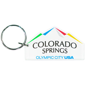 Custom cut keychain of the city of Colorado Springs: Olympic City USA logo. Silver-colored key ring attached. Custom cut to look like mountains.