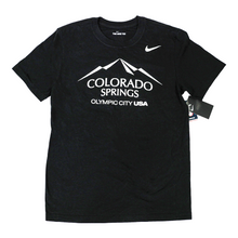 Load image into Gallery viewer, Black short sleeve T-shirt with a white version of the city of Colorado Springs: Olympic City USA logo screen printed onto it. White Nike logo printed underneath the shoulder.
