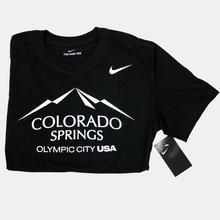 Load image into Gallery viewer, Folded in half black short sleeve T-shirt with a white version of the city of Colorado Springs: Olympic City USA logo screen printed onto it. White Nike logo printed underneath the shoulder.

