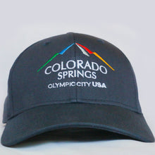 Load image into Gallery viewer, Front view of navy baseball hat with Colorado Springs: Olympic City USA logo embroidered on it 
